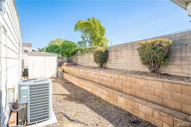 a view of a house with a wooden deck