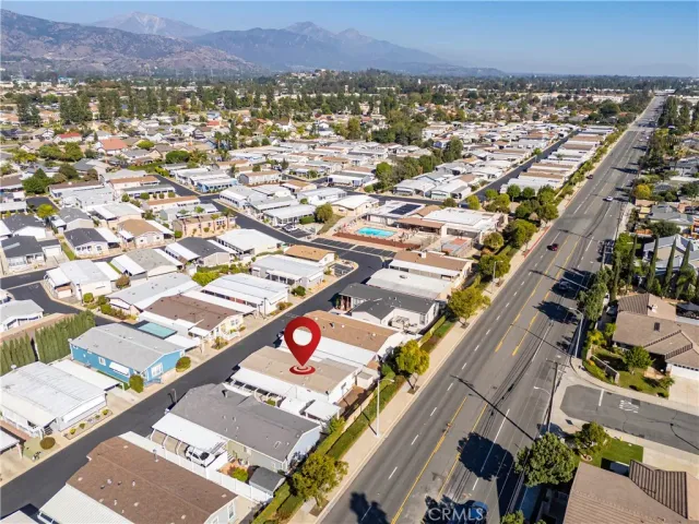 an aerial view of residential houses with city view