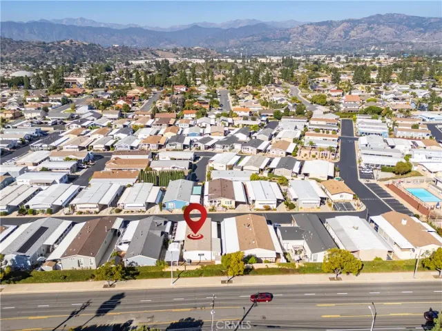 an aerial view of residential houses with city view
