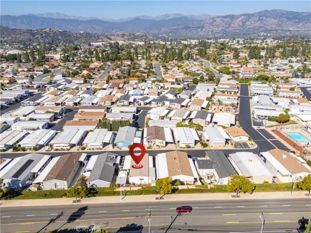 an aerial view of residential houses with city view