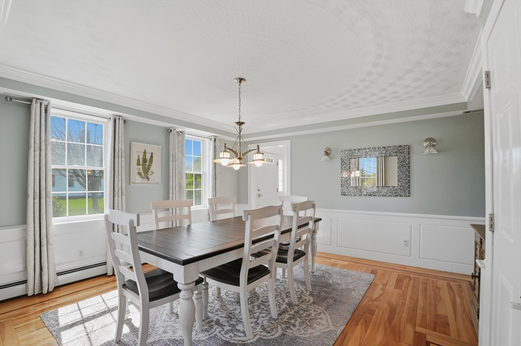183 Whiting Street Hanover, MA 02339 - Photo 11 of 42 a view of a dining room with furniture and wooden floor