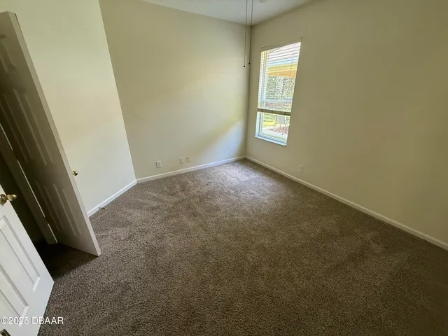 a view of an empty room and window