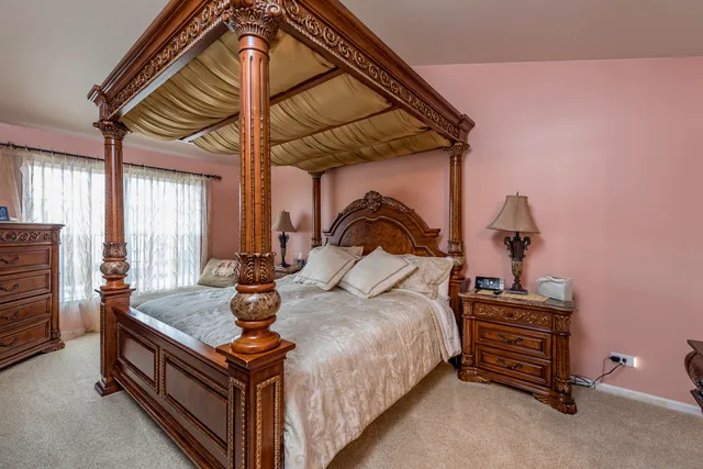 a bedroom with a bed and a dresser