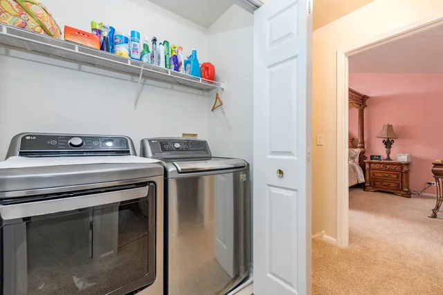 a utility room with washer and dryer