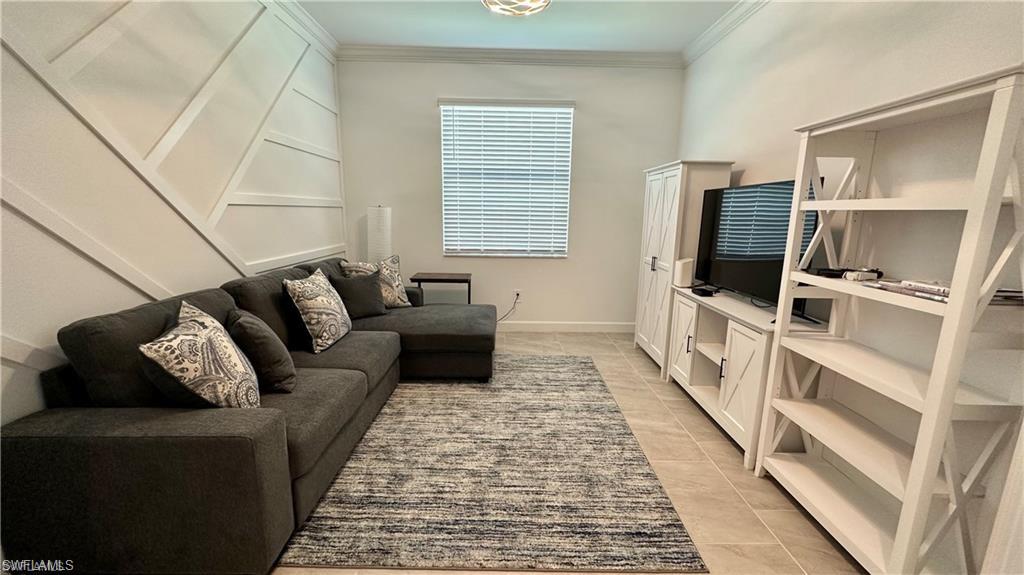 20015 Napa Loop Estero, FL 33928 - Photo 16 of 29 a living room with furniture and a flat screen tv