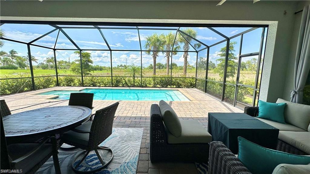 20015 Napa Loop Estero, FL 33928 - Photo 18 of 29 a view of a dining room with furniture and a window