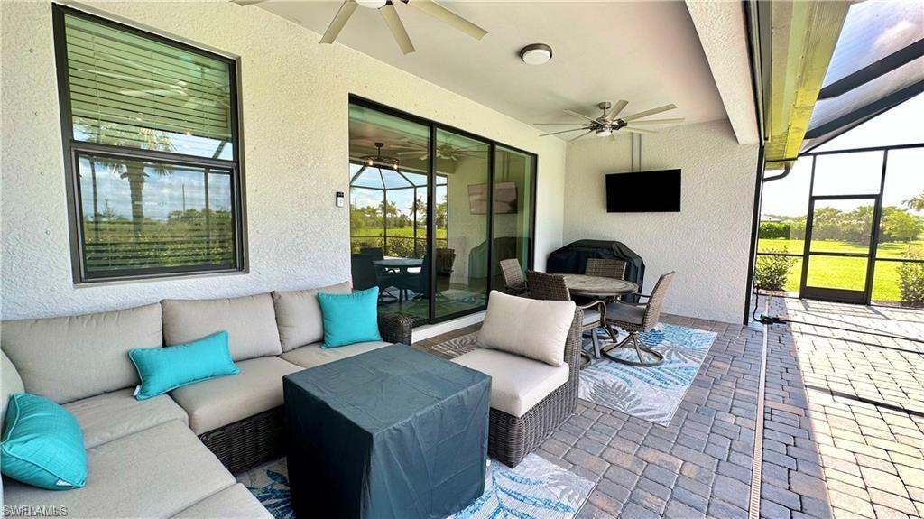 20015 Napa Loop Estero, FL 33928 - Photo 19 of 29 a living room with furniture and a large window