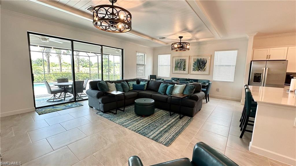 20015 Napa Loop Estero, FL 33928 - Photo 4 of 29 a living room with furniture and a flat screen tv