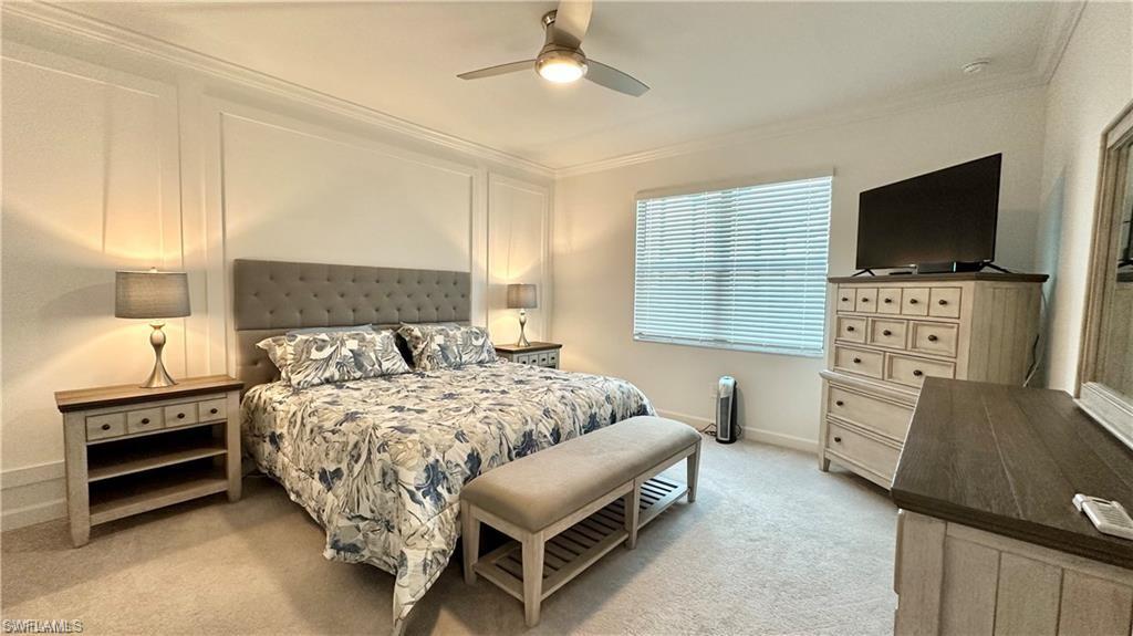 20015 Napa Loop Estero, FL 33928 - Photo 8 of 29 a bedroom with a bed and a flat screen tv