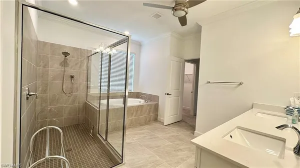 a bedroom with two beds and a small car