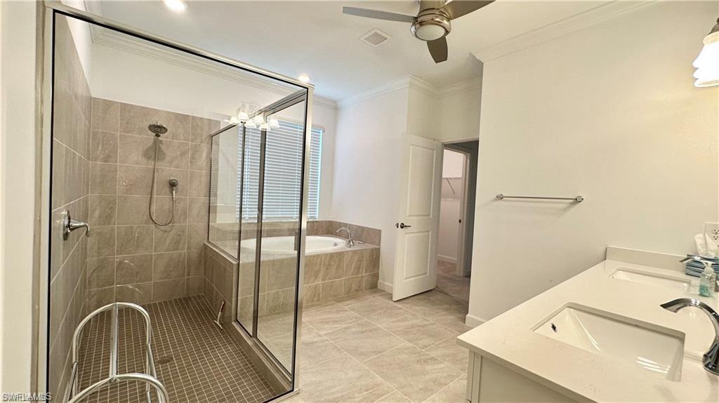 20015 Napa Loop Estero, FL 33928 - Photo 9 of 29 a bathroom with a sink a mirror and a shower