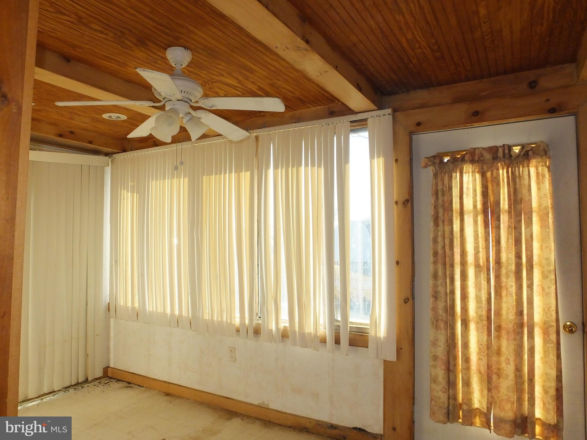 1213 Horse Point Road Fishing Creek, MD 21634 - Photo 17 of 23 a view of an empty room with a window