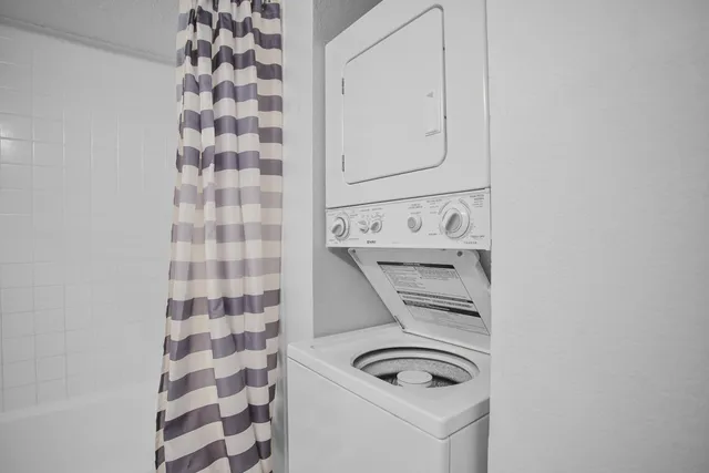 a bathroom with a bathtub and shower