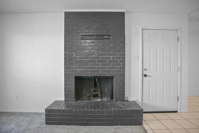 a living room with a fireplace