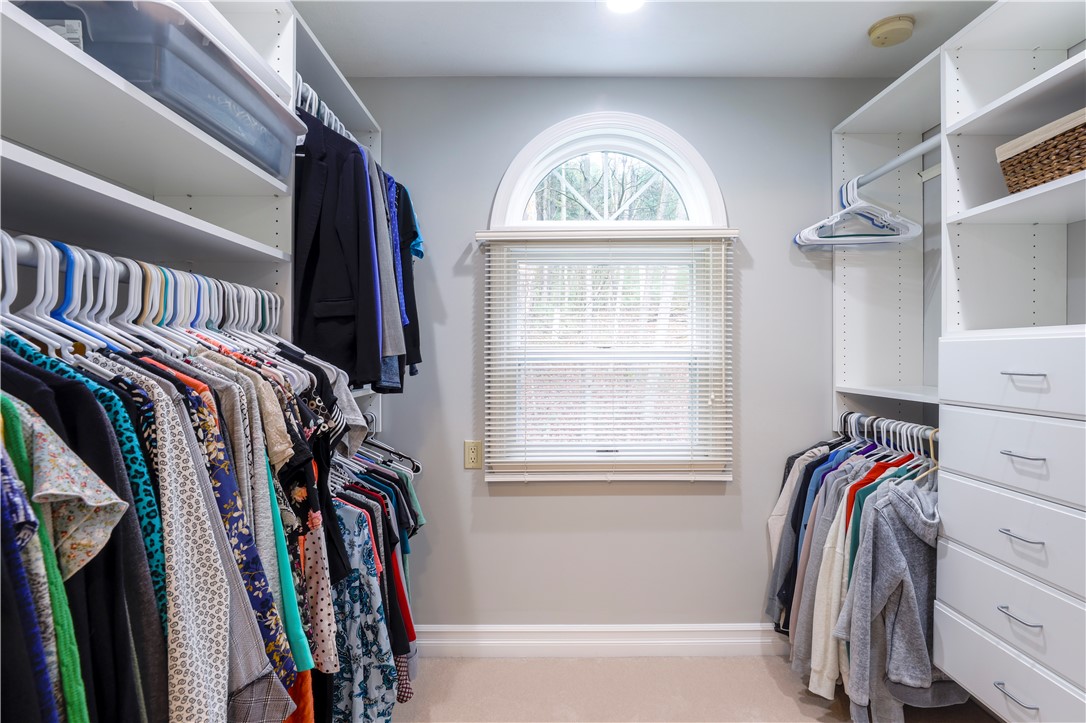 2304 Whiskey Creek Road Corning, NY 14830 - Photo 22 of 42 Primary bedroom walk-in closet has been perfectly designed to handle all of your wardrobe needs.