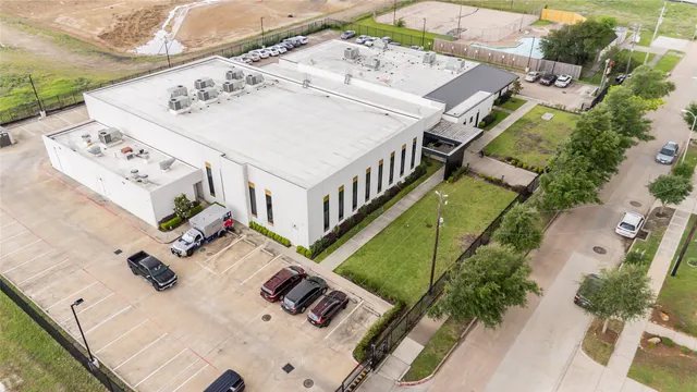 an aerial view of a house with outdoor space