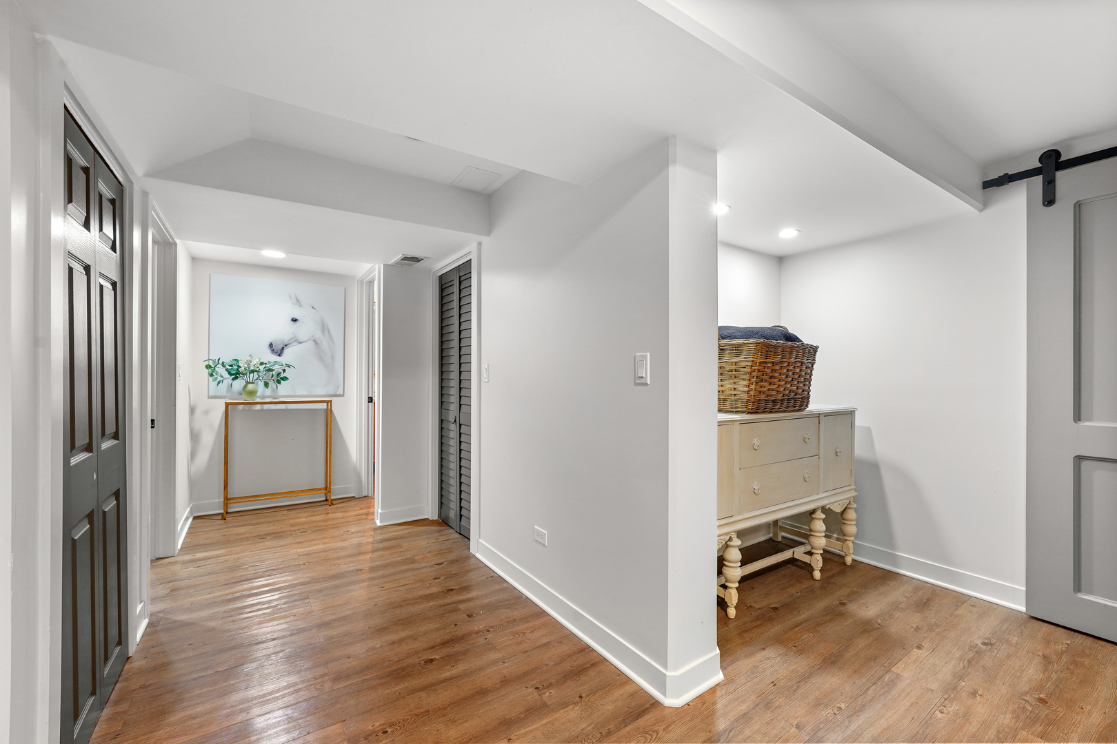 475 Cedar Street Winnetka, IL 60093 - Photo 35 of 46 a view of a hallway with wooden floor and a living room