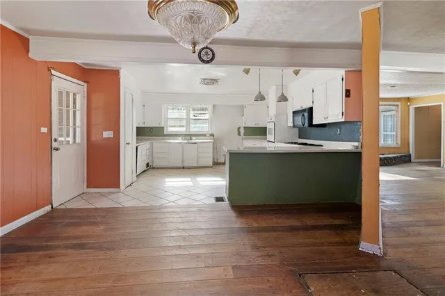 a view of kitchen and windows