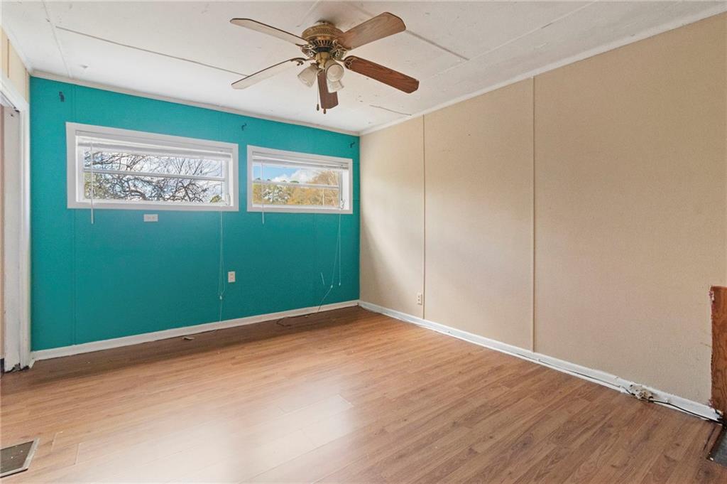 74 Hulsey Road Cedartown, GA 30125 - Photo 19 of 36 an empty room with wooden floor closet and windows
