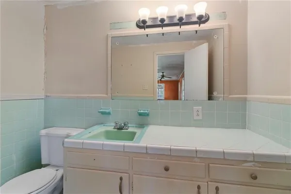 a bathroom with a sink and a toilet