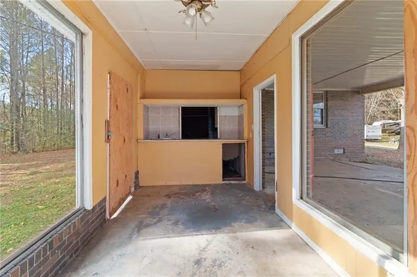 a view of a hallway with a outdoor space