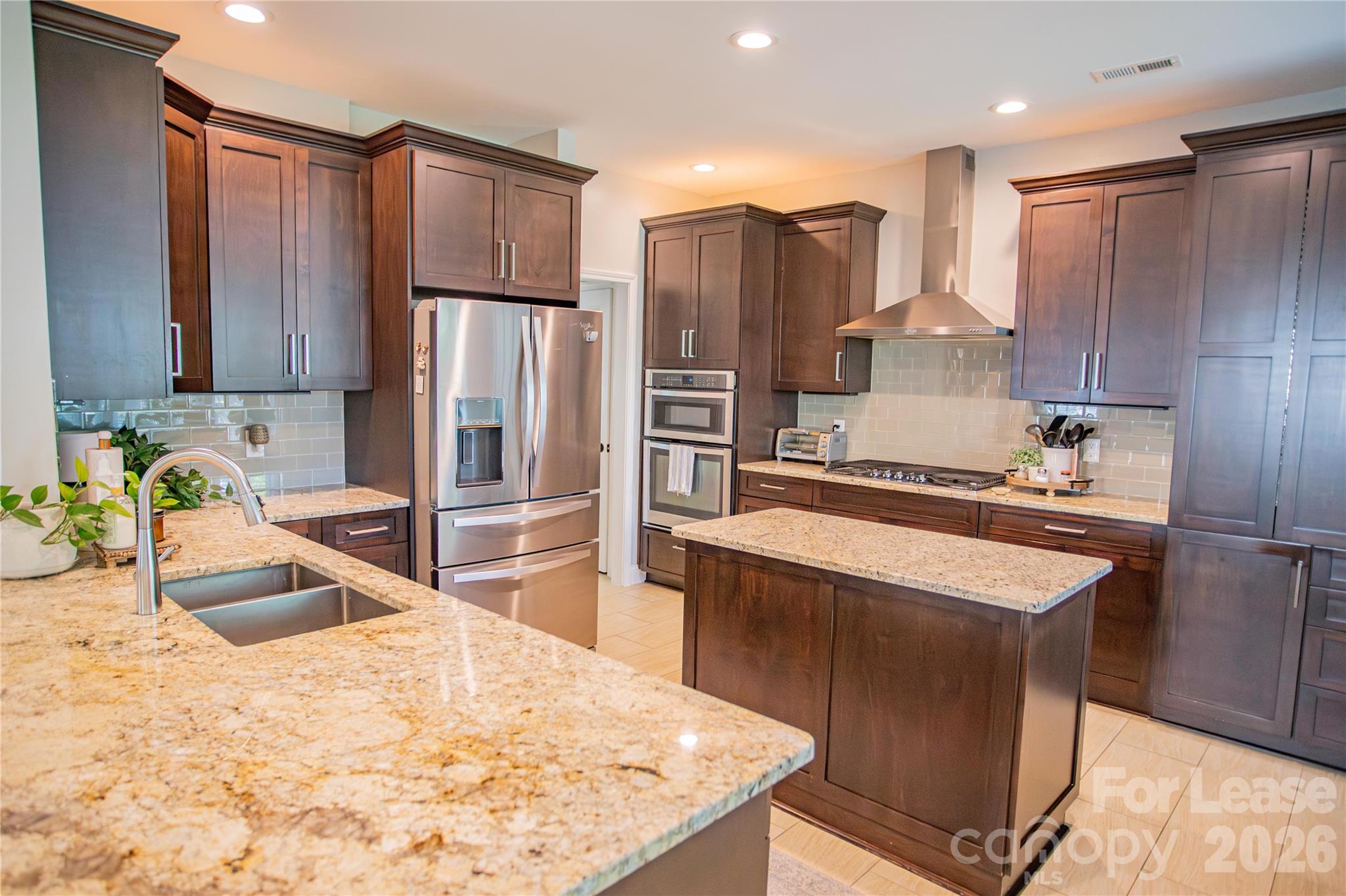 615 Circle Trace Road Monroe, NC 28110 - Photo 2 of 16 a kitchen with stainless steel appliances granite countertop a refrigerator a stove and a sink