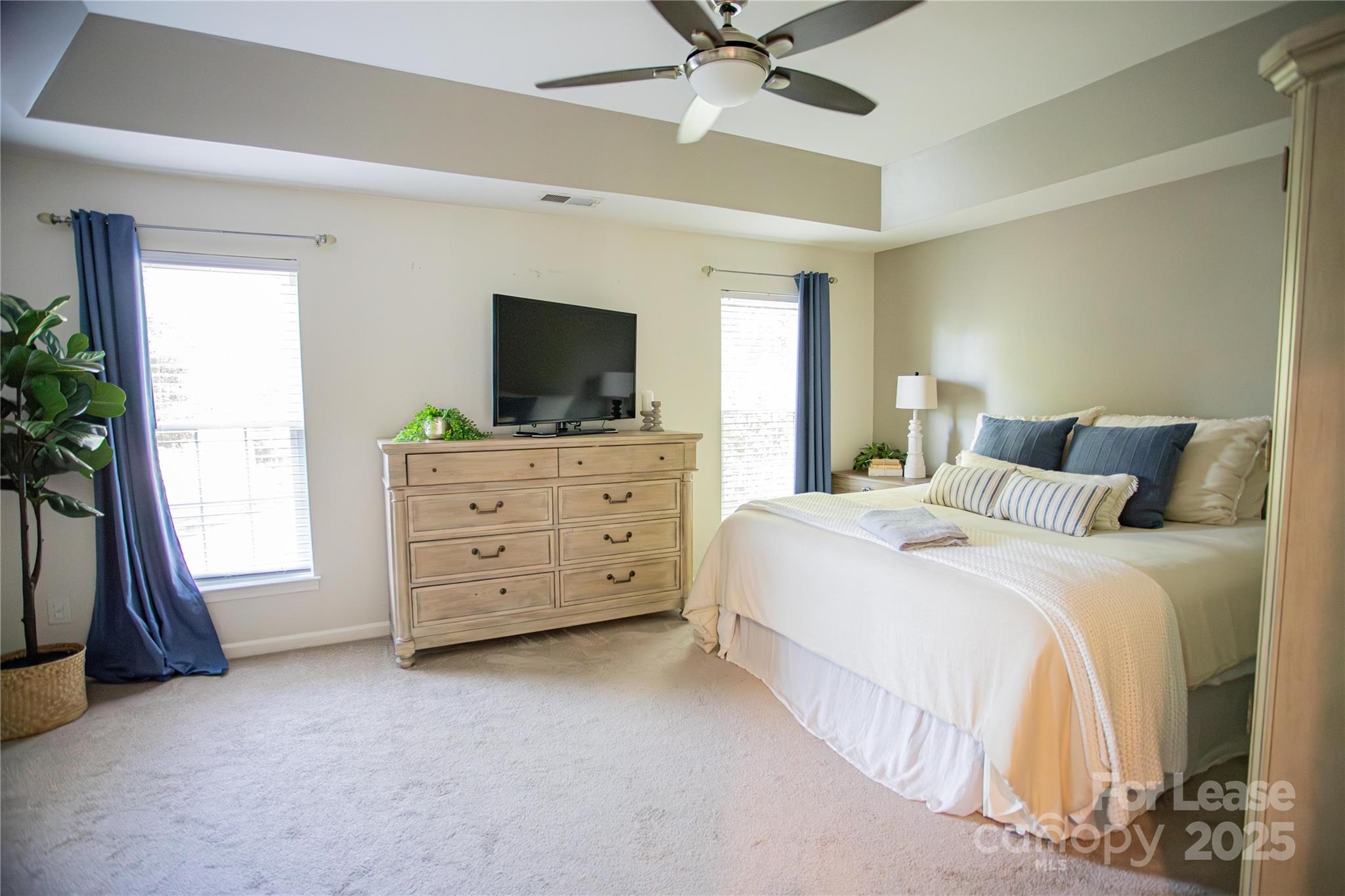 615 Circle Trace Road Monroe, NC 28110 - Photo 4 of 16 a bedroom with a bed and a flat tv screen on dresser