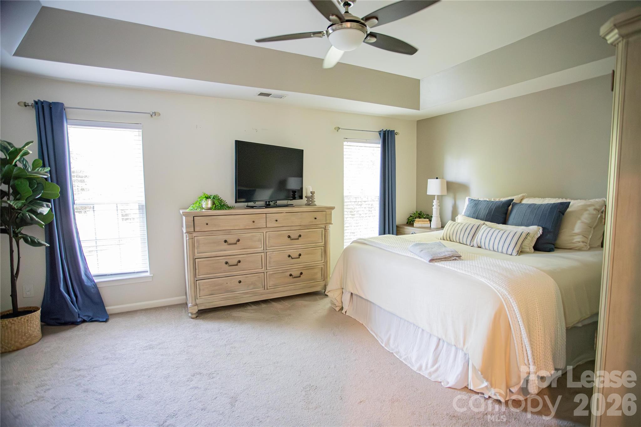 615 Circle Trace Road Monroe, NC 28110 - Photo 4 of 16 a bedroom with a bed and a flat tv screen on dresser