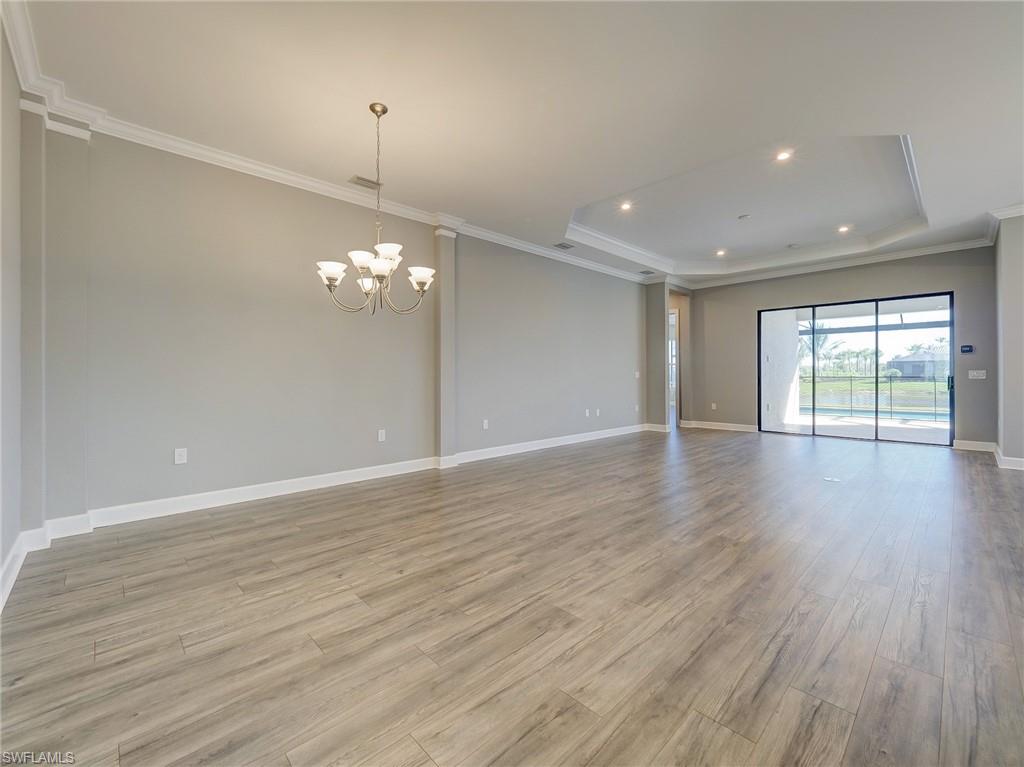 15107 Pescara Street Naples, FL 34114 - Photo 13 of 31 a view of livingroom with hardwood floor and window