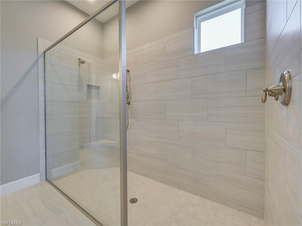 15107 Pescara Street Naples, FL 34114 - Photo 25 of 31 a bathroom with a shower