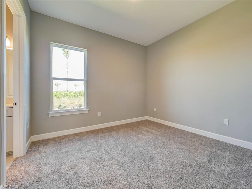 15107 Pescara Street Naples, FL 34114 - Photo 27 of 31 an empty room with windows