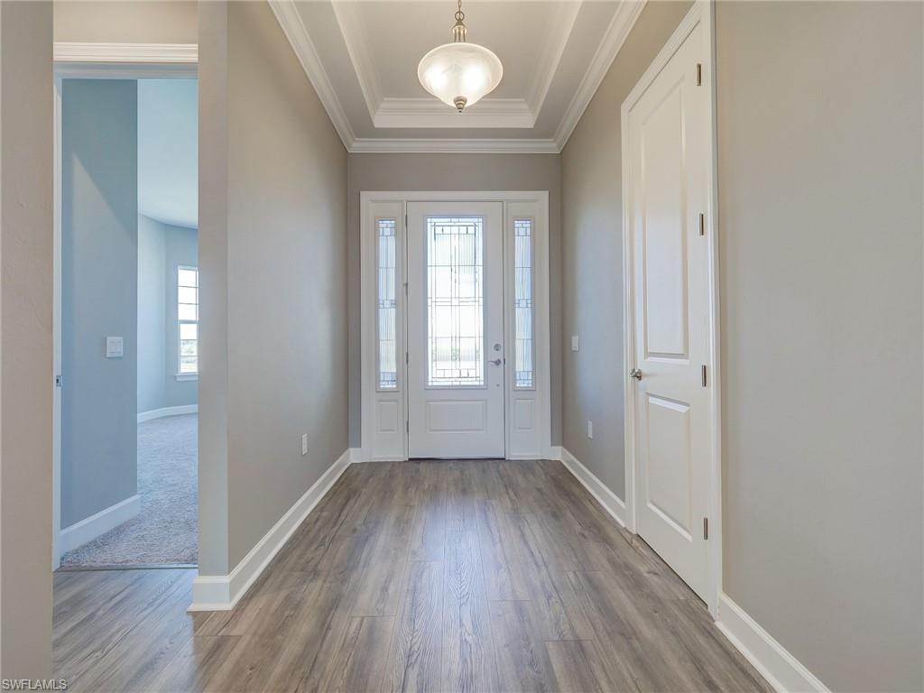 15107 Pescara Street Naples, FL 34114 - Photo 7 of 31 a view of empty room with wooden floor and fan