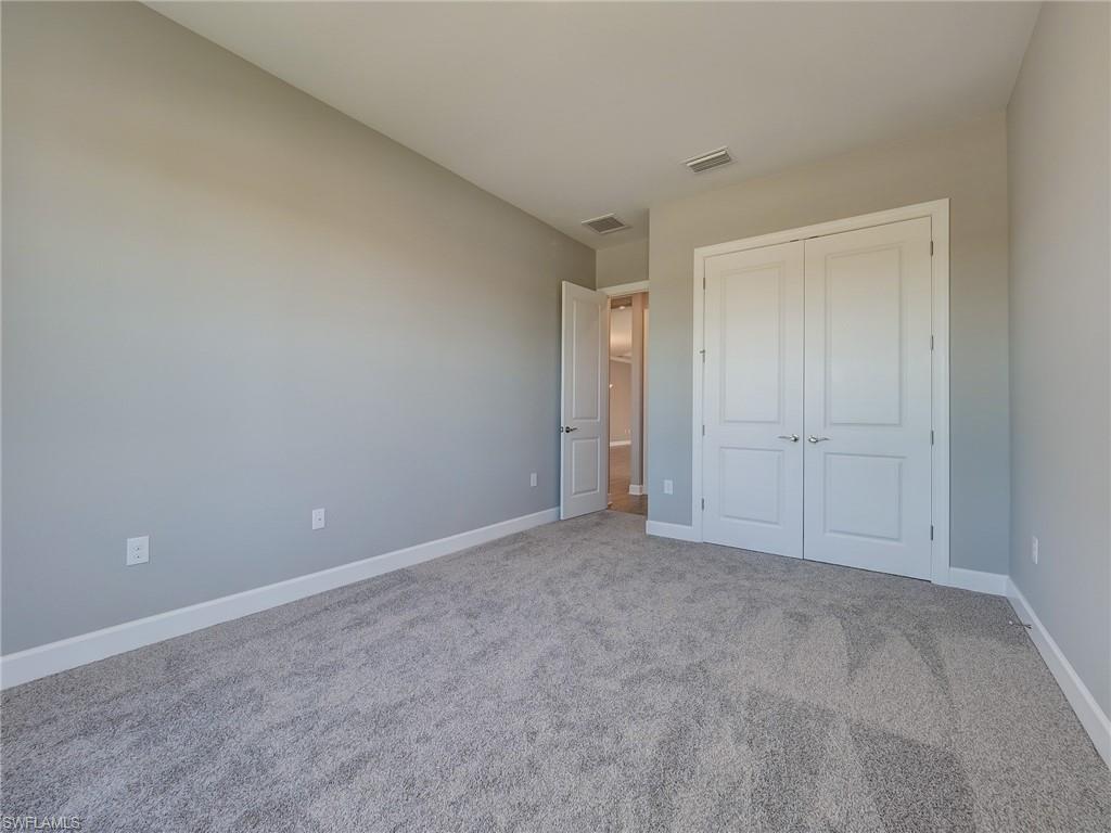 15107 Pescara Street Naples, FL 34114 - Photo 9 of 31 a view of an empty room and closet area