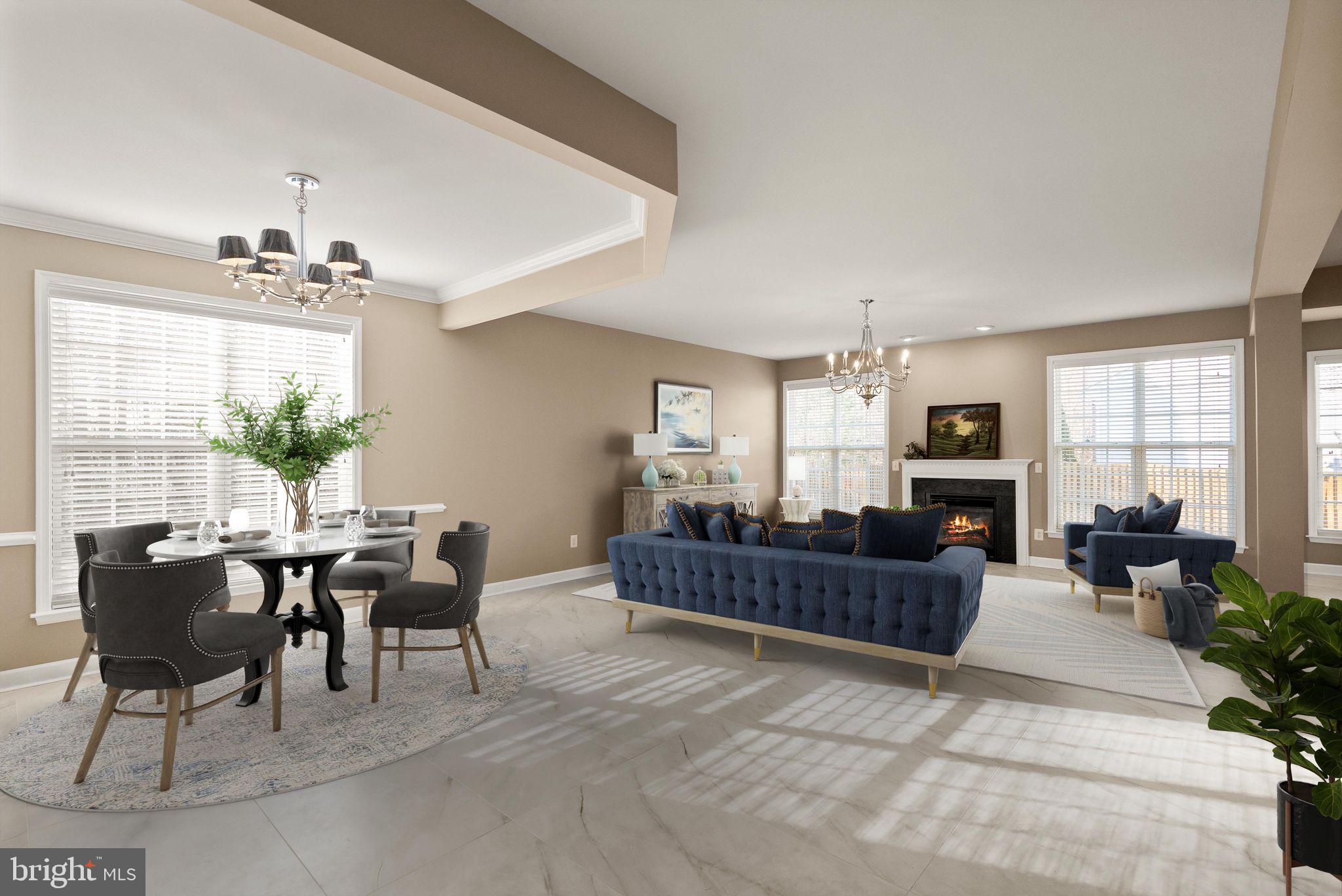 7722 Yalta Way Gainesville, VA 20155 - Photo 16 of 75 a living room with furniture and a chandelier
