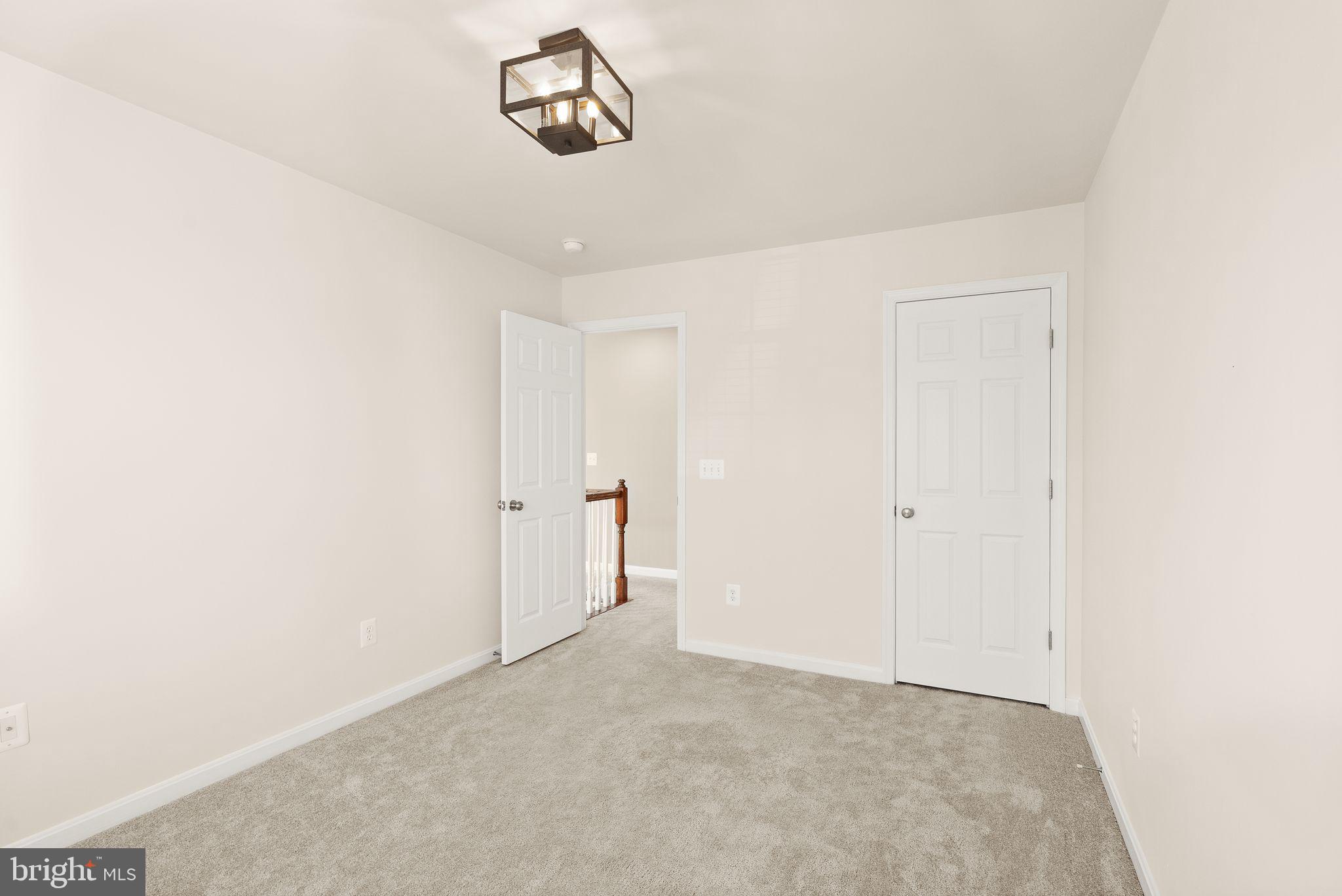 7722 Yalta Way Gainesville, VA 20155 - Photo 45 of 75 a view of a room with a white wall and a refrigerator