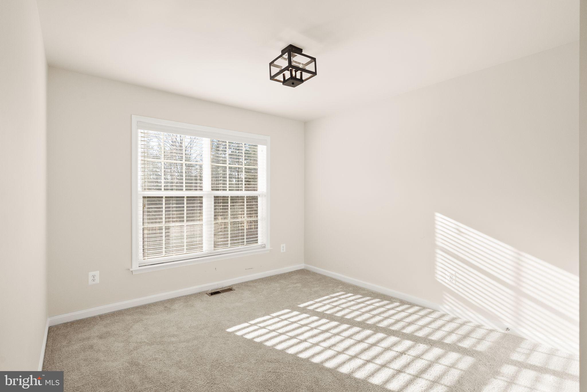 7722 Yalta Way Gainesville, VA 20155 - Photo 46 of 75 a view of an empty room and a window