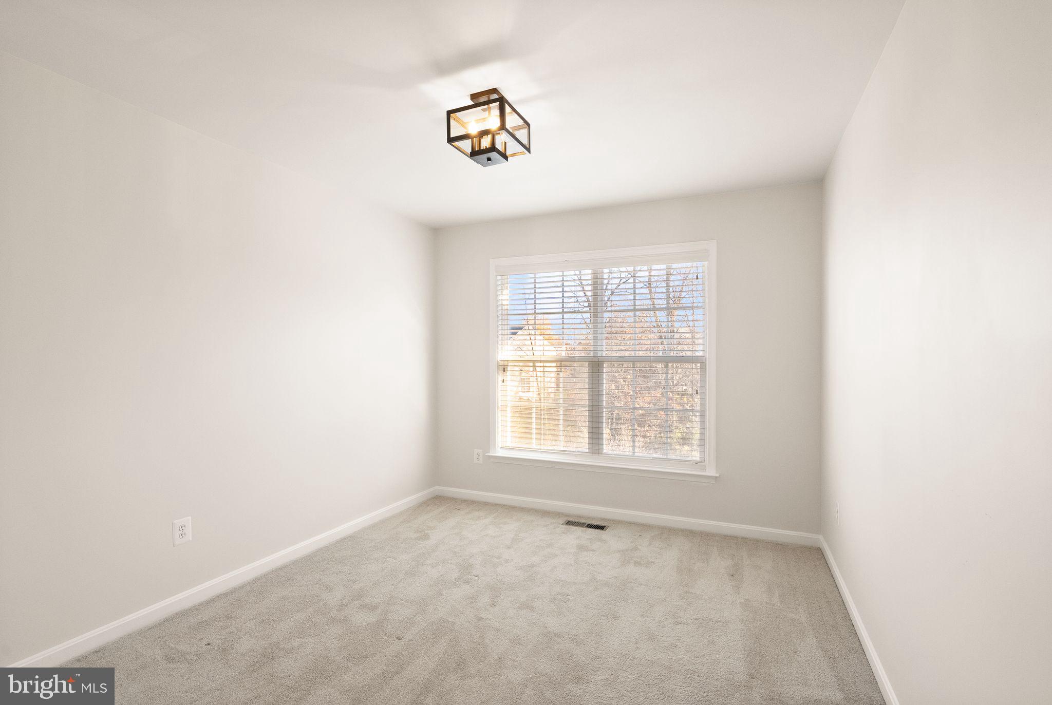 7722 Yalta Way Gainesville, VA 20155 - Photo 48 of 75 an empty room with a window