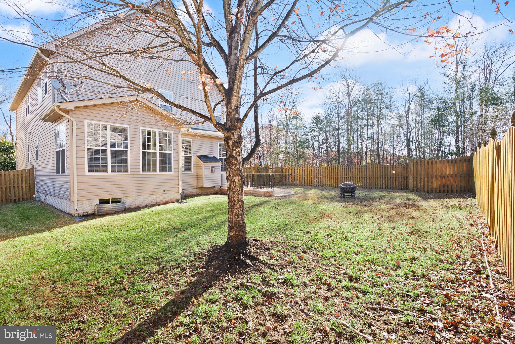 7722 Yalta Way Gainesville, VA 20155 - Photo 64 of 75 a view of a house with backyard and trees