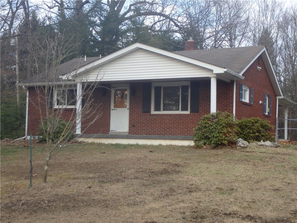 8132 Ridge Road Natrona Heights, PA 15065 - Photo 1 of 16 a front view of a house with a yard and garage