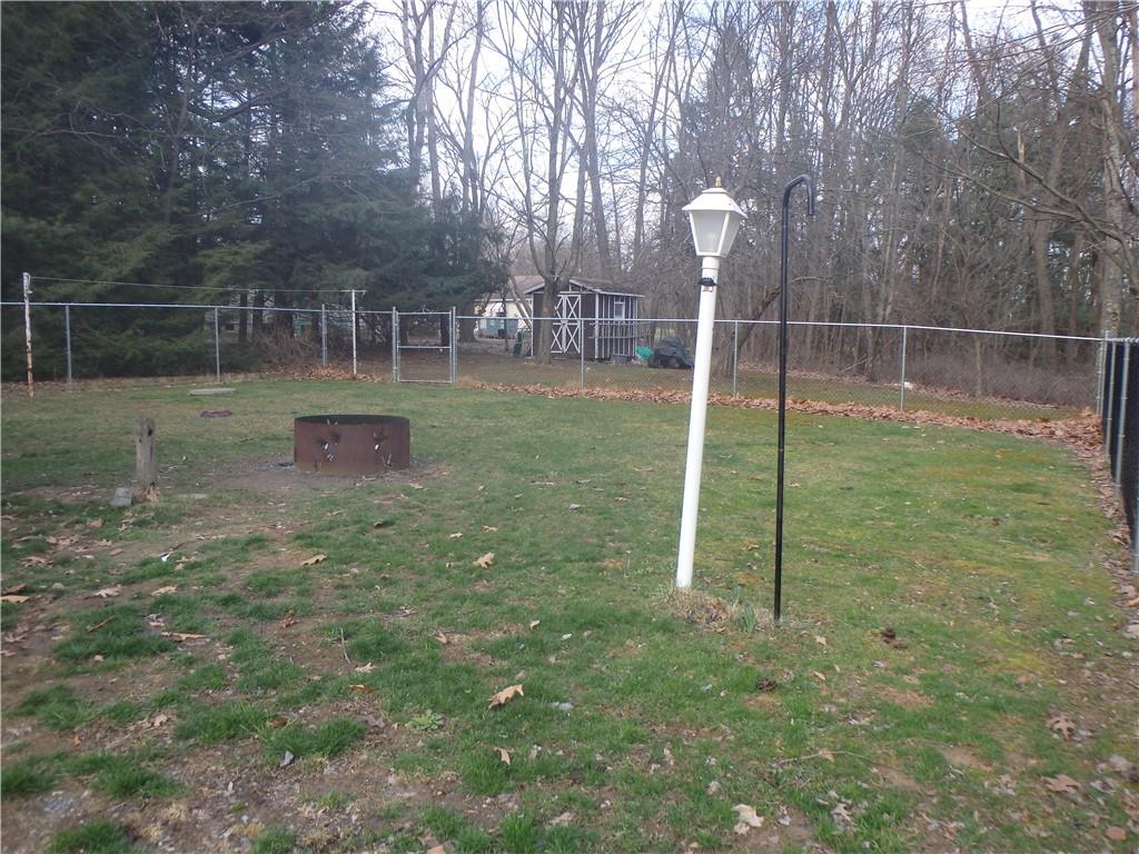 8132 Ridge Road Natrona Heights, PA 15065 - Photo 13 of 16 a backyard of a house with lots of green space and plants