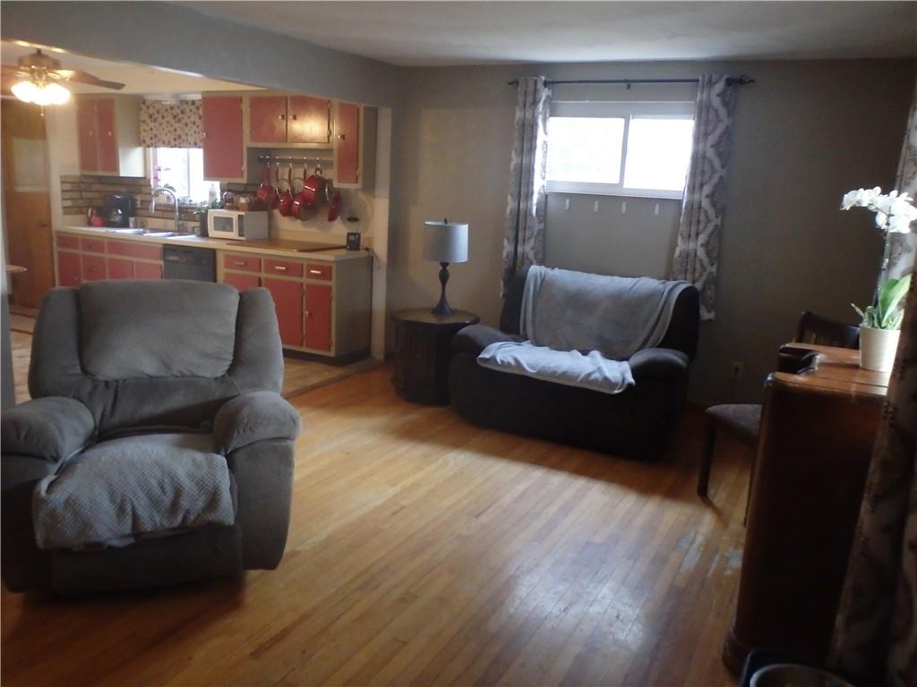 8132 Ridge Road Natrona Heights, PA 15065 - Photo 3 of 16 a living room with furniture and a wooden floor