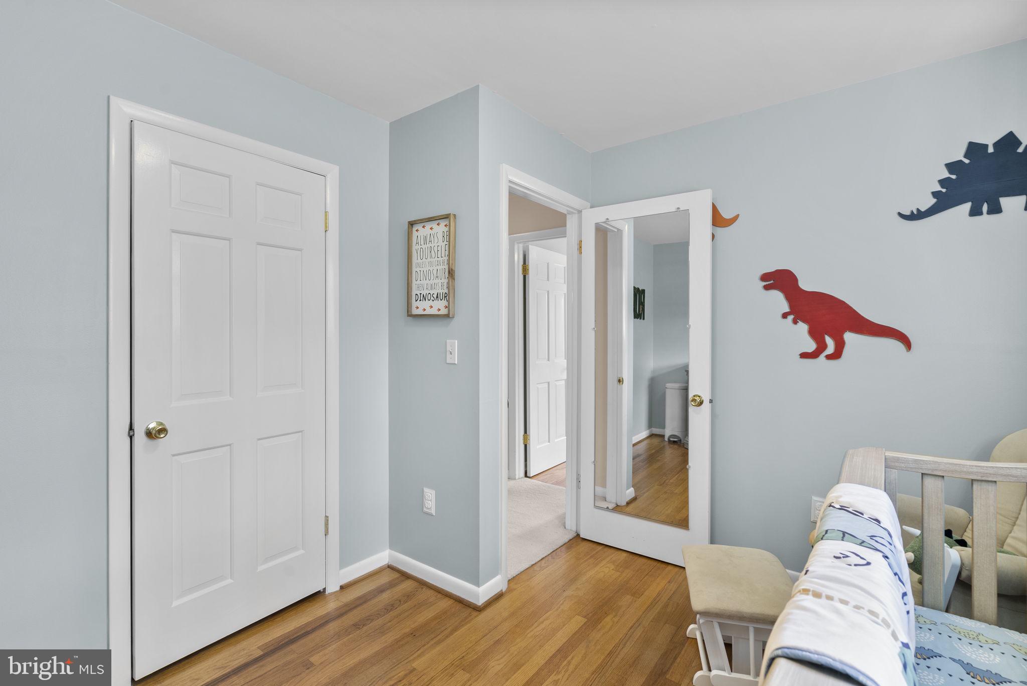 712 Petersburg Road Davidsonville, MD 21035 - Photo 13 of 37 a view of a room with wooden floor and a ceiling fan