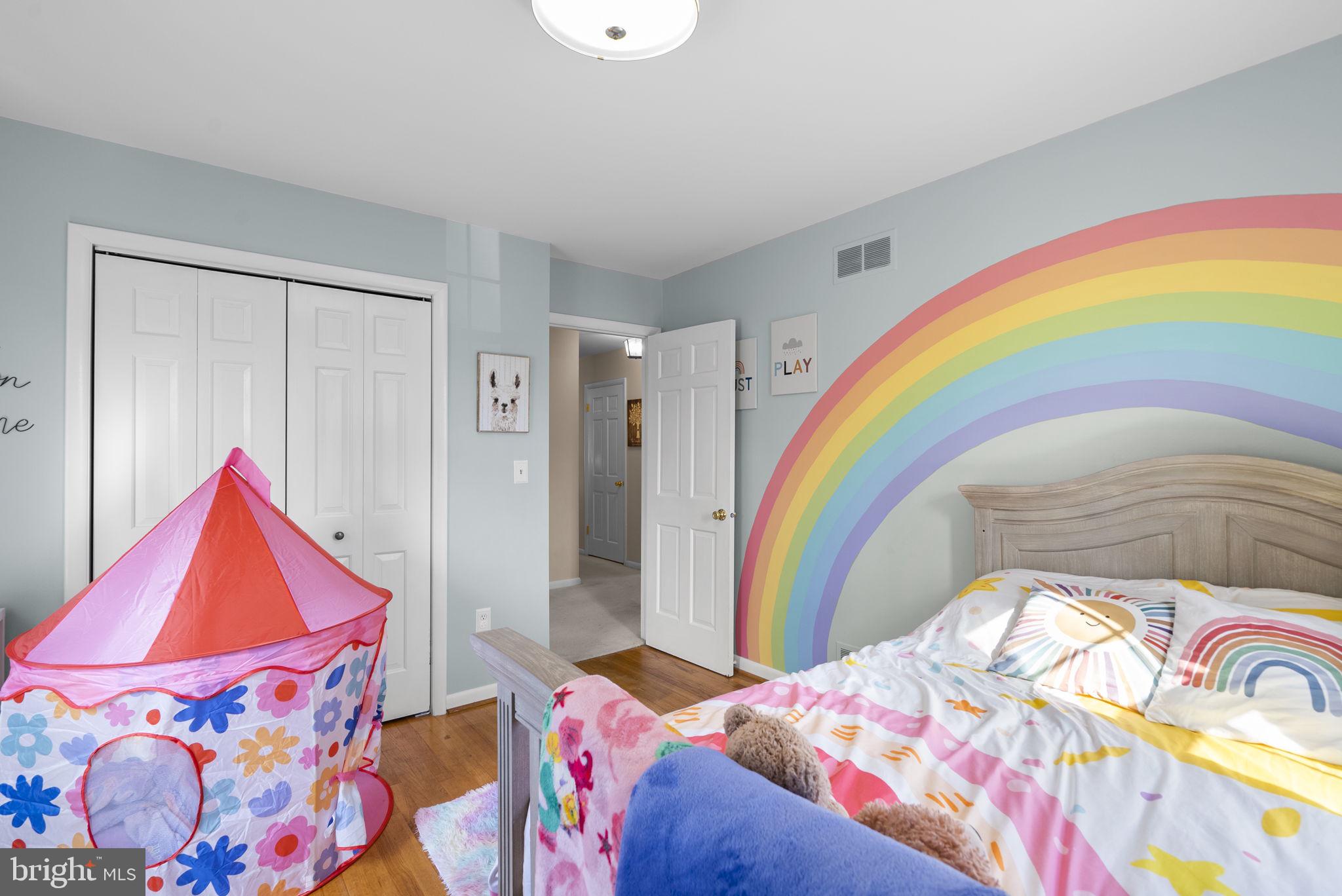 712 Petersburg Road Davidsonville, MD 21035 - Photo 15 of 37 a bedroom with a bed and a painting on the wall