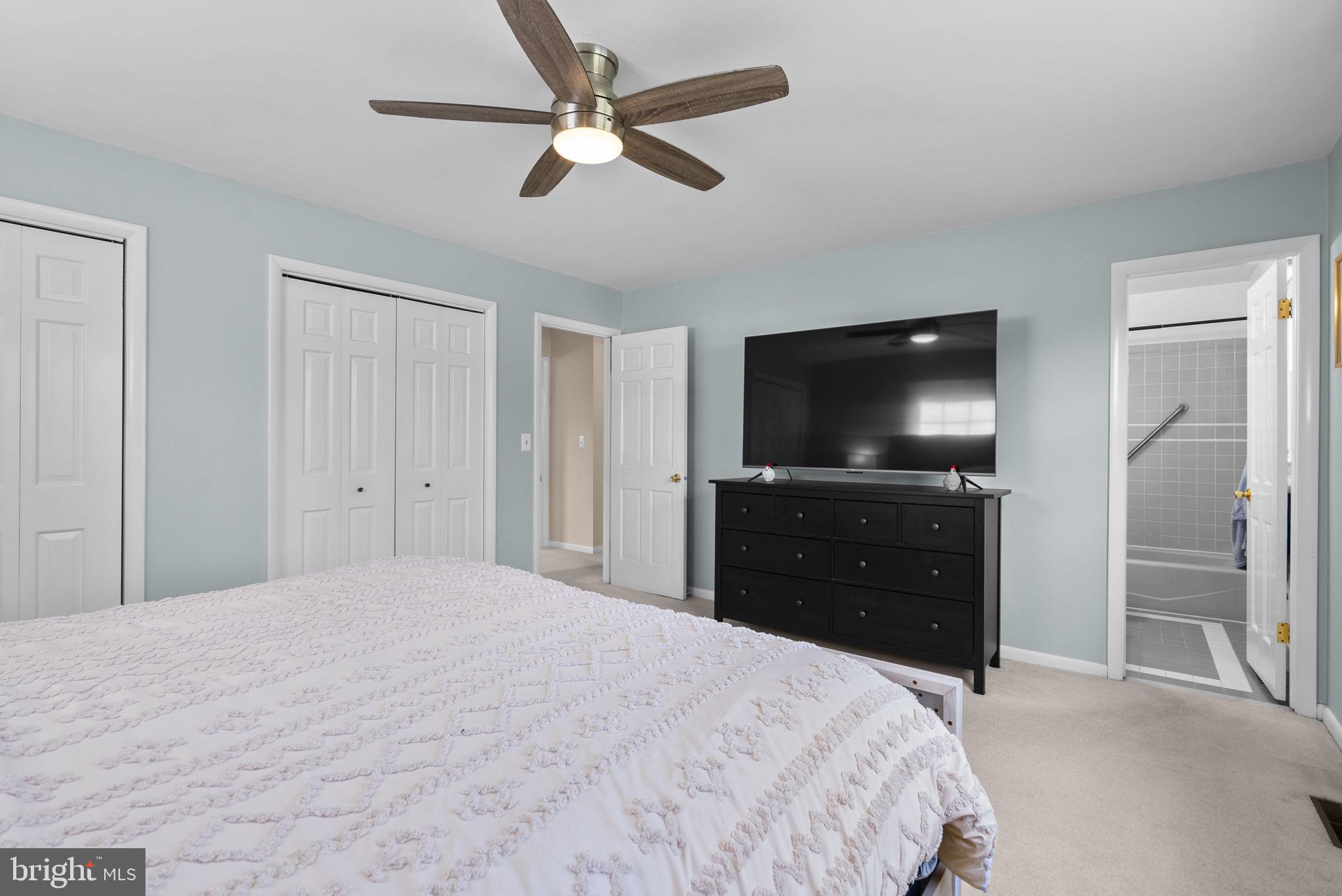 712 Petersburg Road Davidsonville, MD 21035 - Photo 18 of 37 a bedroom with a bed and a flat screen tv