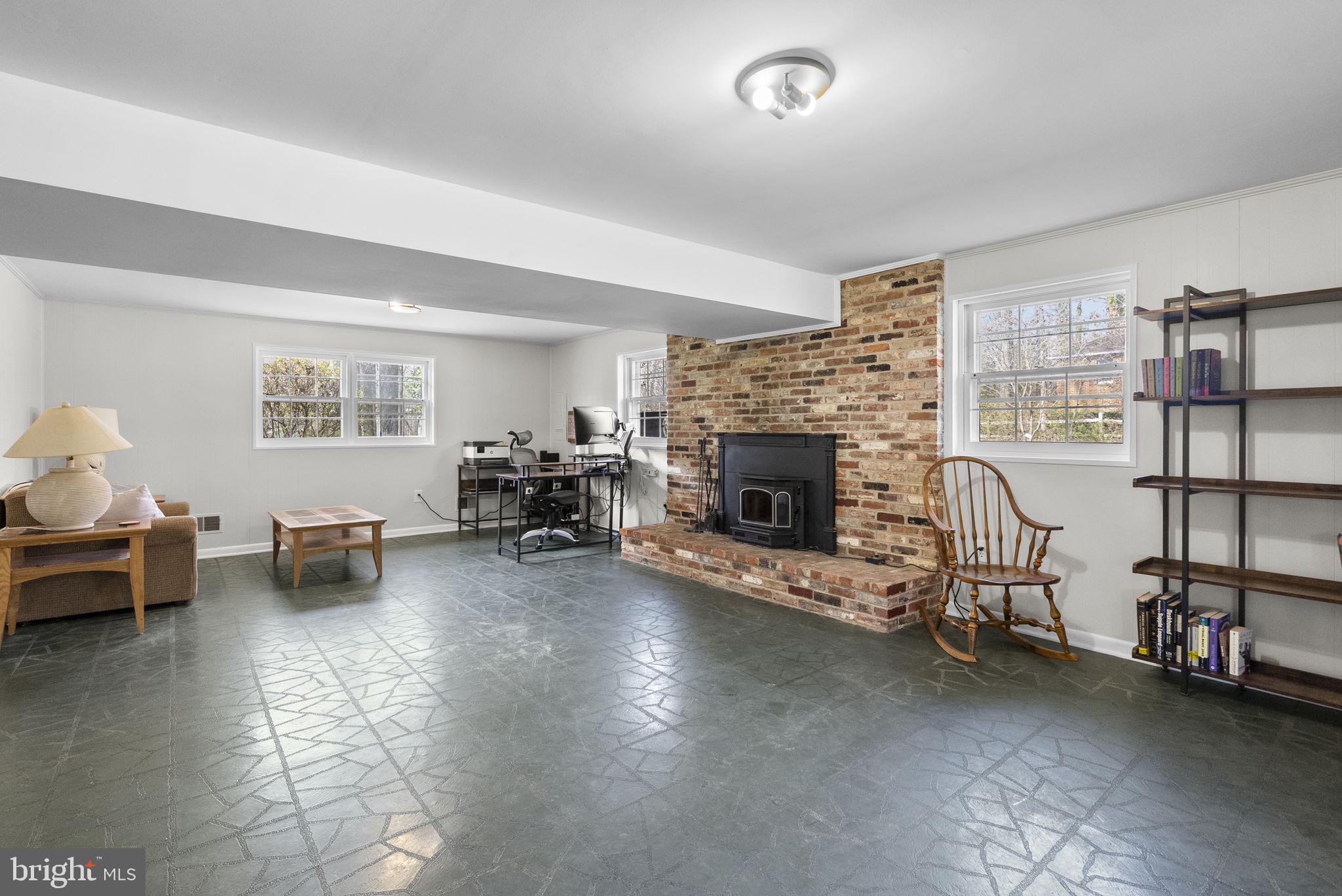 712 Petersburg Road Davidsonville, MD 21035 - Photo 20 of 37 a living room with furniture and a fireplace