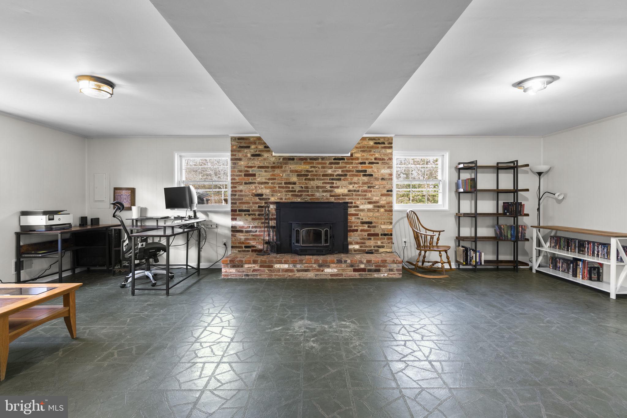 712 Petersburg Road Davidsonville, MD 21035 - Photo 21 of 37 a living room with furniture and a fireplace