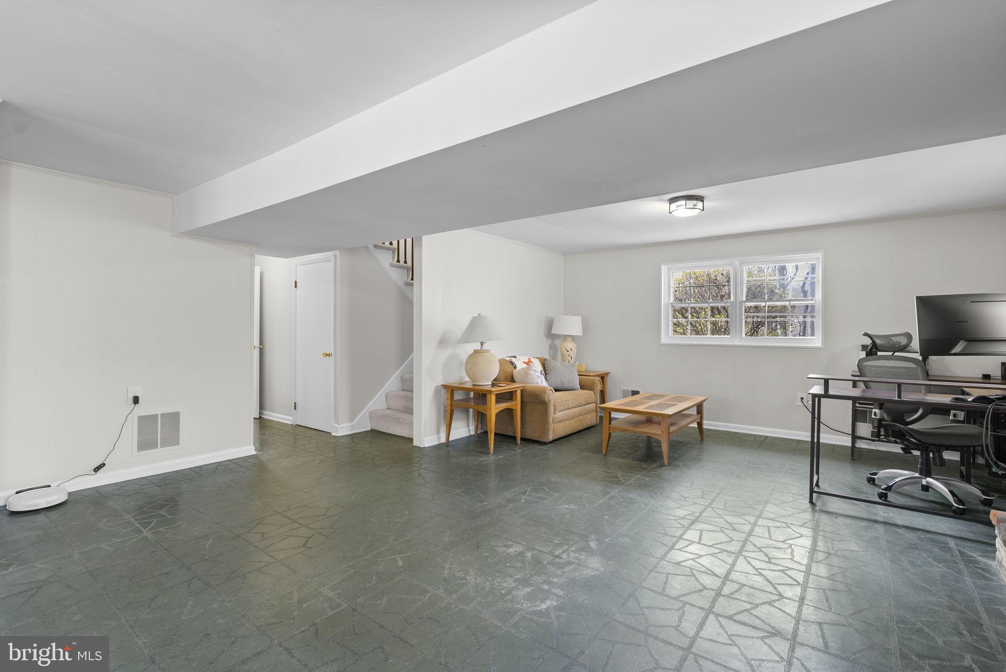 712 Petersburg Road Davidsonville, MD 21035 - Photo 23 of 37 a living room with furniture and a flat screen tv