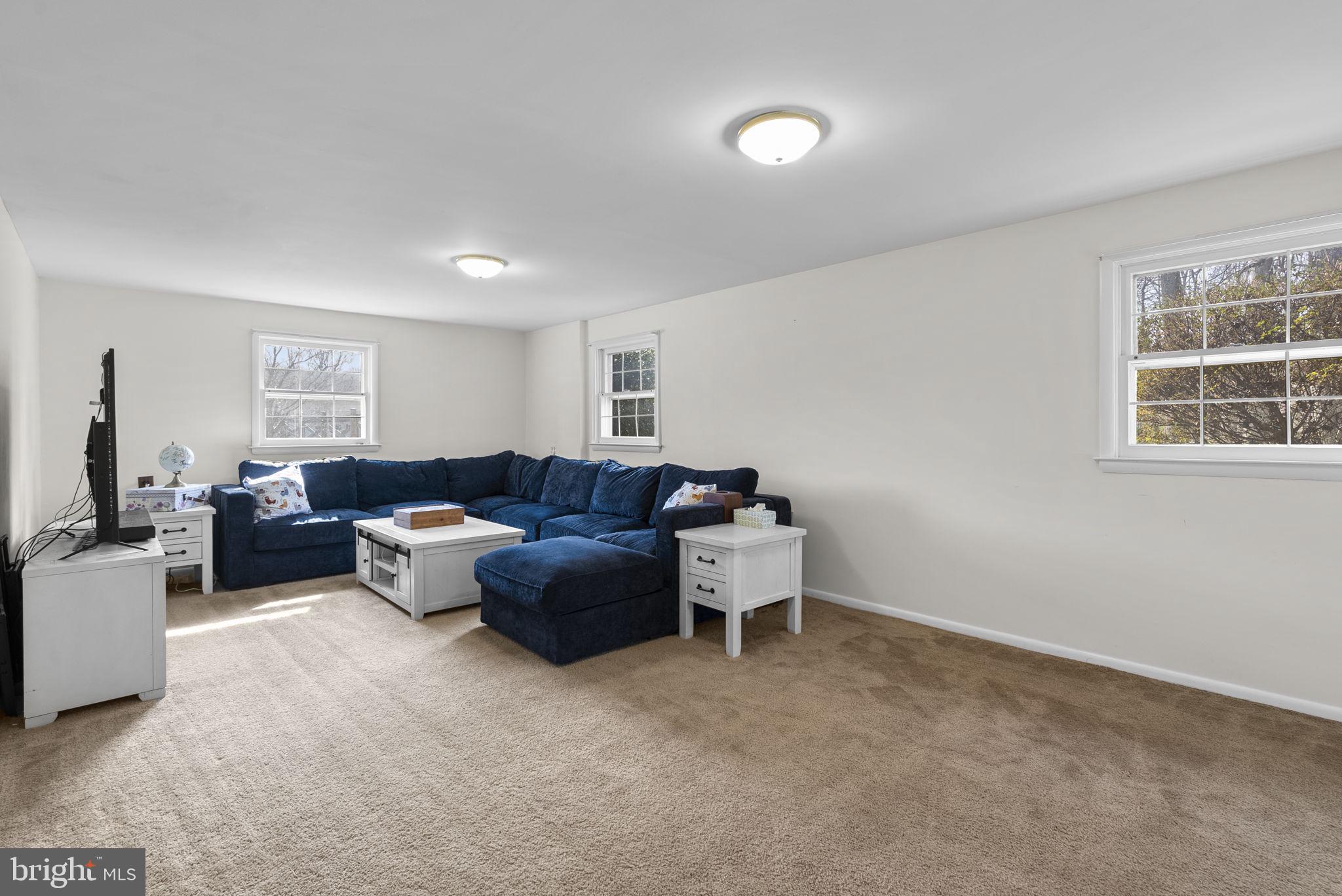 712 Petersburg Road Davidsonville, MD 21035 - Photo 24 of 37 a living room with furniture and a window