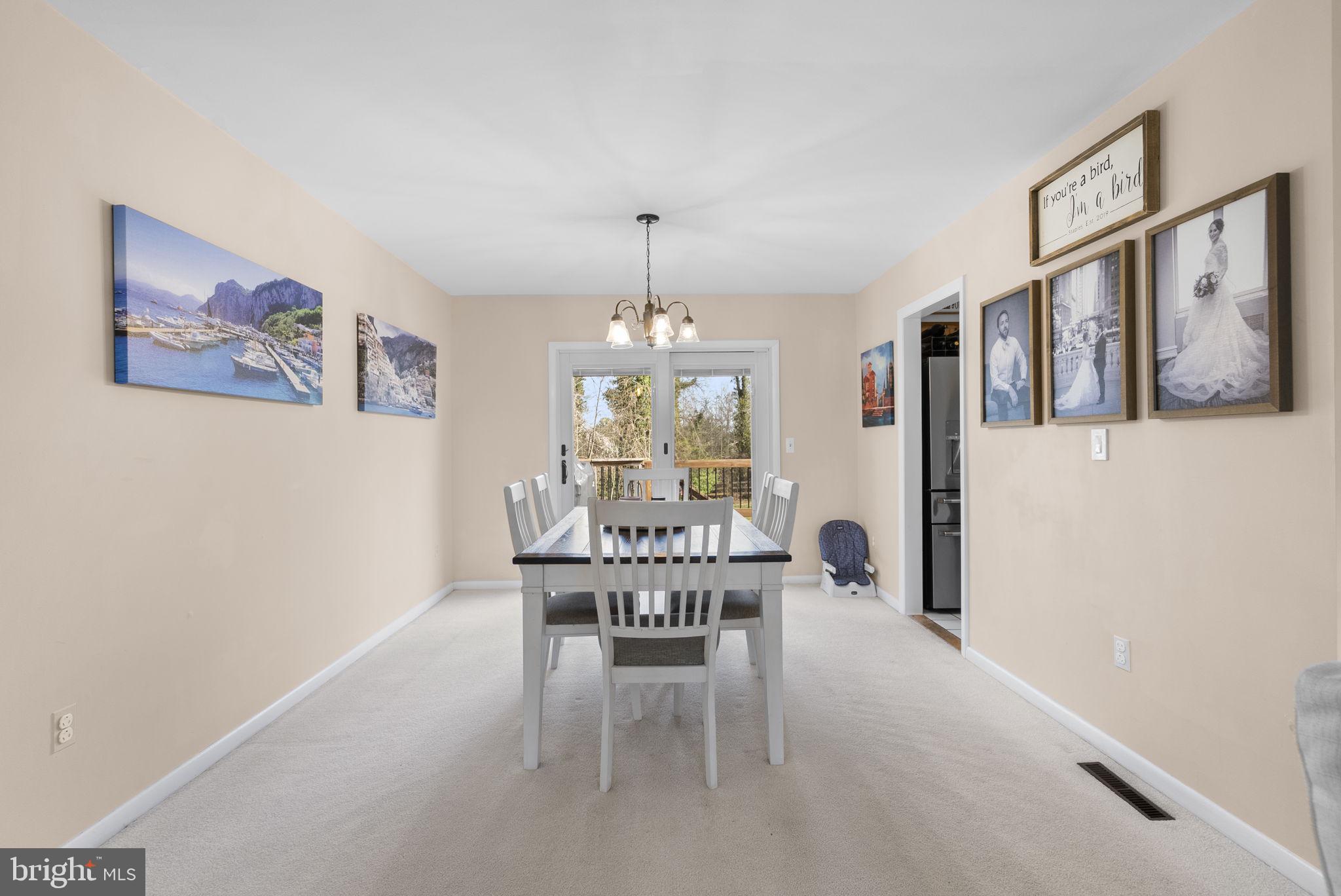 712 Petersburg Road Davidsonville, MD 21035 - Photo 6 of 37 a view of a dining room with furniture window and outside view