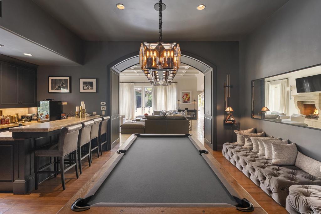 6853 Rancho Valencia Road Rancho Santa Fe, CA 92067 - Photo 11 of 40 a very nice looking room with a large window